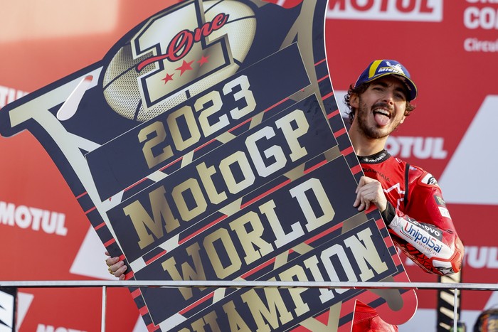 Moto GP World Champion Italian rider Francesco Bagnaia of the Ducati Lenovo Team celebrates after the MotoGP race of the Valencia Motorcycle Grand Prix, the last race of the season, at the Ricardo Tormo circuit in Cheste near Valencia, Spain, Sunday, Nov. 26, 2023. (AP Photo/Alberto Saiz)