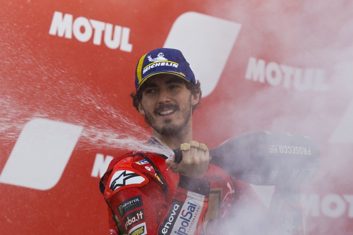 Italian rider Francesco Bagnaia of the Ducati Lenovo Team sprays champagne to celebrate his victory after the MotoGP race of the Valencia Motorcycle Grand Prix, the last race of the season, at the Ricardo Tormo circuit in Cheste near Valencia, Spain, Sunday, Nov. 26, 2023. (AP Photo/Alberto Saiz)