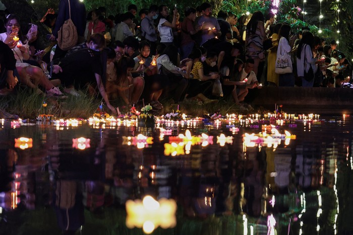 Floating Krathongs, baskets made with leaves and flowers, float in a park lagoon during the Loy Krathong festival which is held as a symbolic apology and to express gratitude to the goddess of the river and to thank for the water, in Bangkok, Thailand, November 27, 2023. REUTERS/Chalinee Thirasupa
