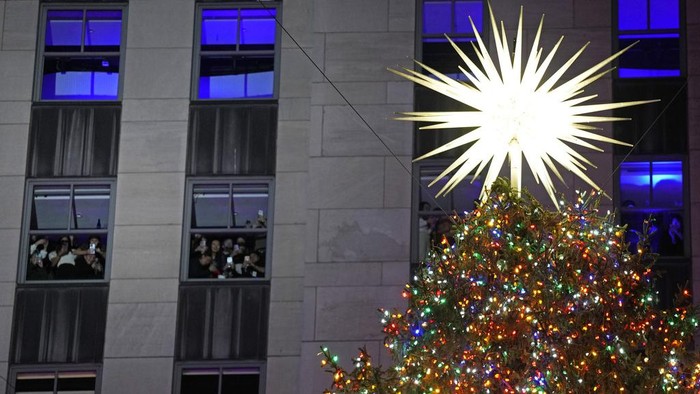 The Rockefeller Center Christmas tree is lit on Wednesday, Nov. 29, 2023, in New York. (Photo by Charles Sykes/Invision/AP)