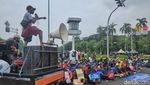 Aksi Warga Papua di Patung Kuda Jakarta