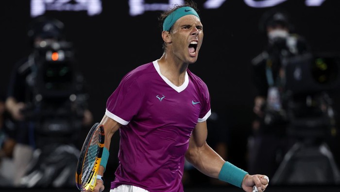 FILE - Rafael Nadal of Spain reacts after winning the third set against Daniil Medvedev of Russia during the mens singles final at the Australian Open tennis championships in Melbourne, Australia, Sunday, Jan. 30, 2022. Rafael Nadal says that he will return to playing at the Brisbane International in Australia in January. (AP Photo/Hamish Blair, File)