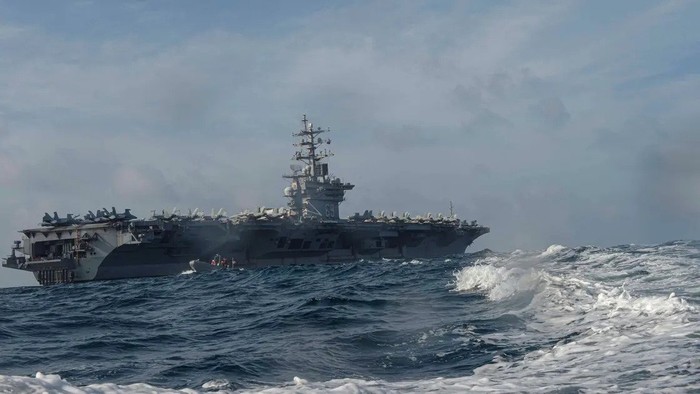 Personnel assigned to the US Navy aircraft carrier USS Dwight D. Eisenhower conduct small boat operations during a training exercise in the Arabian Sea April 17, 2020. (Reuters)