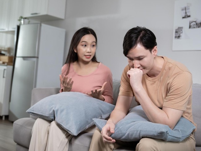 Young married couple asian husband and wife are arguing, angry couple ignoring each other, relationship trouble concept.