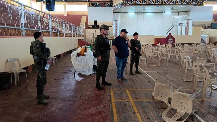 Lanao Del Sur Governor Mamintal Adiong Jr. looks on as law enforcement officers investigate the scene of an explosion that occurred during a Catholic Mass in a gymnasium at Mindanao State University in Marawi, Philippines, December 3, 2023. Lanao Del Sur Provincial Government/Handout via REUTERS/File Photo Acquire Licensing Rights