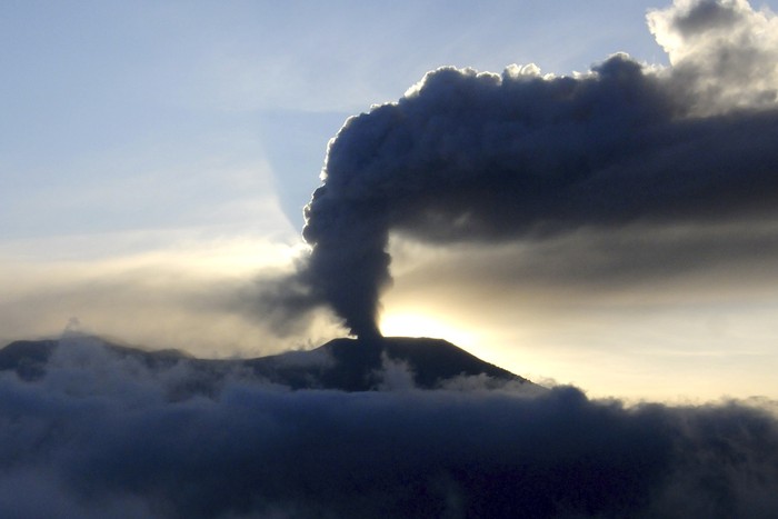 Mount Marapi spews volcanic ash from its crater in Agam, West Sumatra, Indonesia, Tuesday, Dec. 5, 2023.  Indonesian authorities halted Monday the search for a dozen of climbers after Mount Marapi volcano erupted again, unleashing a new burst of hot ash as high as 800 meters (2,620 feet) into the air, officials said. (AP Photo/Ardhy Fernando)