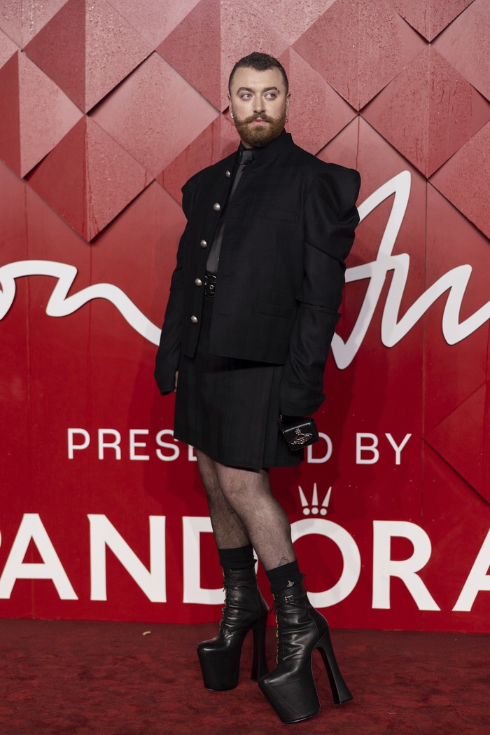 Sam Smith poses for photographers upon arrival at the British Fashion Awards on Monday, Dec. 4, 2023 in London. (Vianney Le Caer/Invision/AP)
