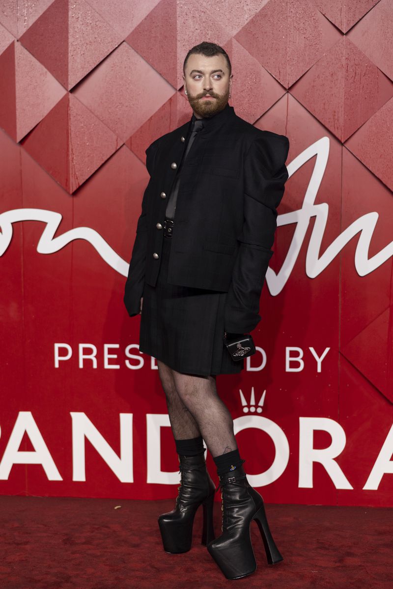 Sam Smith poses for photographers upon arrival at the British Fashion Awards on Monday, Dec. 4, 2023 in London. (Vianney Le Caer/Invision/AP)