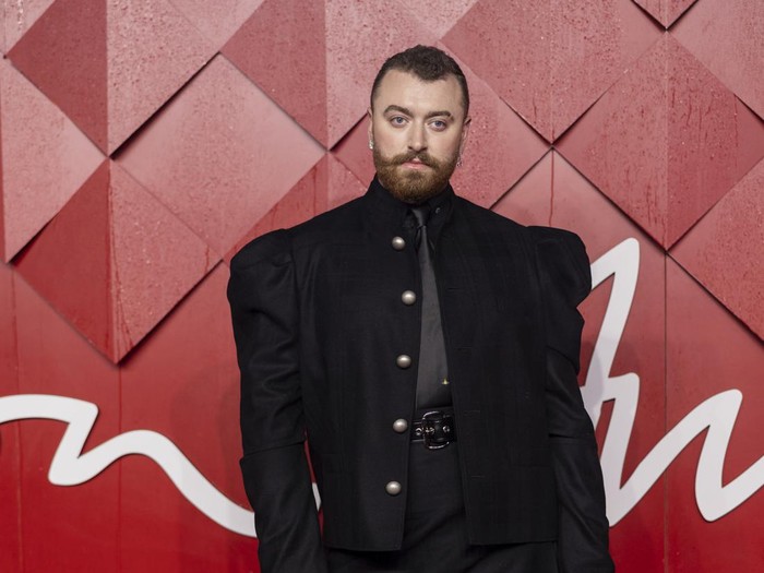 Sam Smith poses for photographers upon arrival at the British Fashion Awards on Monday, Dec. 4, 2023 in London. (Vianney Le Caer/Invision/AP)