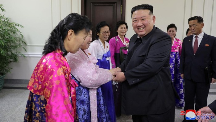 North Korea's leader Kim Jong Un greets supporters at the 5th National Meeting of Mothers in Pyongyang in this picture released by the Korean Central News Agency on December 5, 2023. KCNA via REUTERS ATTENTION EDITORS - THIS IMAGE WAS PROVIDED BY A THIRD PARTY. REUTERS IS UNABLE TO INDEPENDENTLY VERIFY THIS IMAGE. NO THIRD PARTY SALES. SOUTH KOREA OUT. NO COMMERCIAL OR EDITORIAL SALES IN SOUTH KOREA.