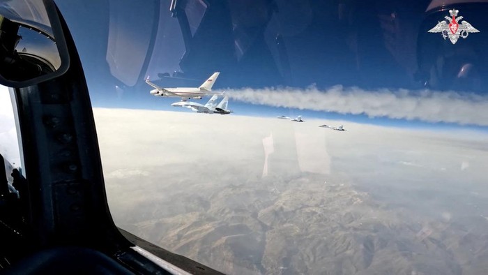 Russian Su-35S combat aircraft escort Russian President Vladimir Putin's plane heading to United Arab Emirates, December 6, 2023, in this still image taken from video. Russian Defence Ministry/Handout via REUTERS ATTENTION EDITORS - THIS IMAGE WAS PROVIDED BY A THIRD PARTY. NO RESALES. NO ARCHIVES. MANDATORY CREDIT. WATERMARK FROM SOURCE.