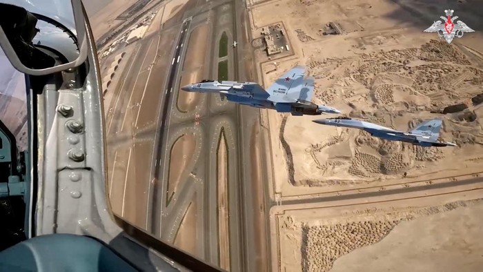 Russian Su-35S combat aircraft escort Russian President Vladimir Putin's plane heading to United Arab Emirates, December 6, 2023, in this still image taken from video. Russian Defence Ministry/Handout via REUTERS ATTENTION EDITORS - THIS IMAGE WAS PROVIDED BY A THIRD PARTY. NO RESALES. NO ARCHIVES. MANDATORY CREDIT. WATERMARK FROM SOURCE.