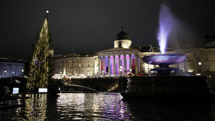 A view of the Trafalgar Square Christmas tree following its annual lighting ceremony in London, Thursday, Dec. 7, 2023. The 25-metre-high tree from the people of Norway is a gift of thanks for Britain's support to Norway during World War II. (AP Photo/David Cliff)