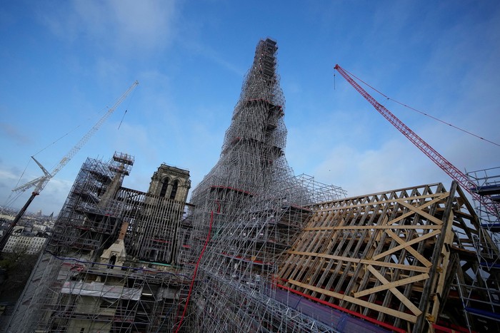 Notre Dame de Paris cathedral is pictured from the top of the spire Friday, Dec. 8, 2023 in Paris, France. French President Emmanuel Macron is visiting Notre Dame Cathedral on Friday, marking the one-year countdown to its reopening in 2024 following extensive restoration after the fire four years ago. Macron’s visit, continuing his annual tradition since the blaze on April 15 2019, is aimed to highlight the progress in the works, including the near completion of the cathedral spire.     Christophe Ena/Pool via REUTERS