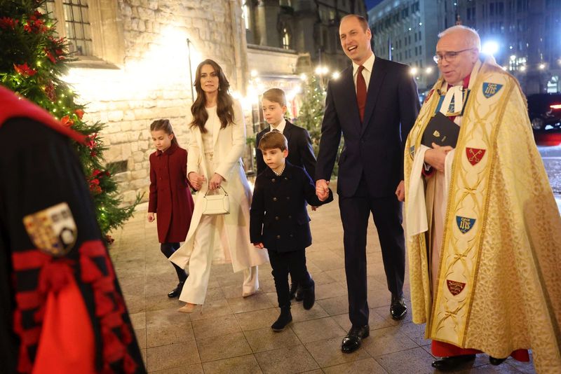 Britain's Kate, Princess of Wales, with her children Princess Charlotte and Prince Louis attend the Together At Christmas carol service at Westminster Abbey in London, Friday, Dec. 8, 2023. Spearheaded by The Princess of Wales and supported by The Royal Foundation, the service is a moment to bring people together at Christmas time and recognise those who have gone above and beyond to help others throughout the year. (Chris Jackson/Pool via AP)