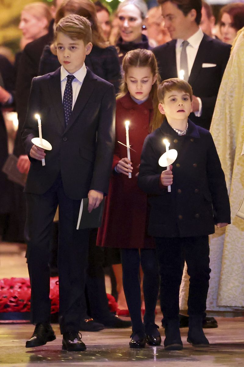 Britain's Kate, Princess of Wales, with her children Princess Charlotte and Prince Louis attend the Together At Christmas carol service at Westminster Abbey in London, Friday, Dec. 8, 2023. Spearheaded by The Princess of Wales and supported by The Royal Foundation, the service is a moment to bring people together at Christmas time and recognise those who have gone above and beyond to help others throughout the year. (Chris Jackson/Pool via AP)