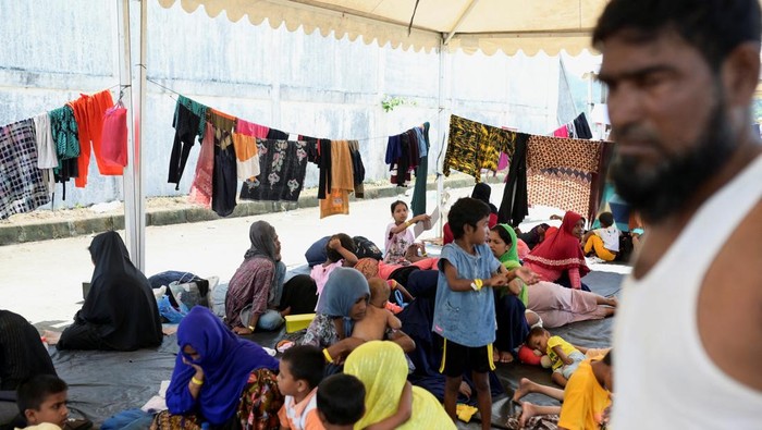 Rohingya Muslim refugees are seen at a port warehouse that is used as temporary shelter, in Sabang, Aceh province, Indonesia, December 8, 2023. REUTERS/Riska Munawarah