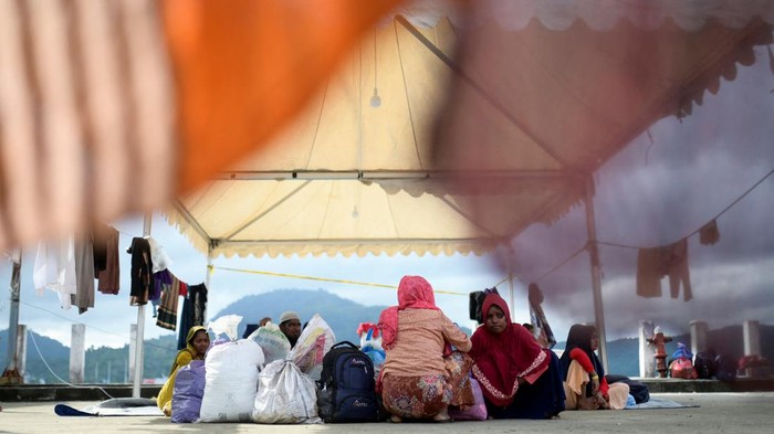 Rohingya Muslim refugees are seen at a port warehouse that is used as temporary shelter, in Sabang, Aceh province, Indonesia, December 8, 2023. REUTERS/Riska Munawarah