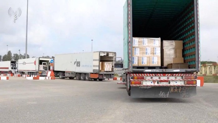 Humanitarian aid trucks wait in line to be inspected at the Kerem Shalom crossing, amid the ongoing conflict between Israel and the Palestinian Islamist group Hamas, on the border between Israel, Gaza and Egypt in this still image taken from video released December 12, 2023.    COGAT via X/Handout via REUTERS    THIS IMAGE HAS BEEN SUPPLIED BY A THIRD PARTY. NO RESALES. NO ARCHIVES. MANDATORY CREDIT. WATERMARK FROM SOURCE