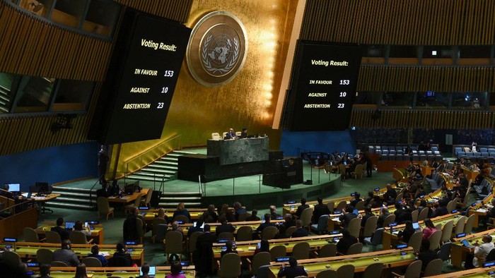 A general view shows voting results during a United Nations General Assembly meeting to vote on a non-binding resolution demanding 