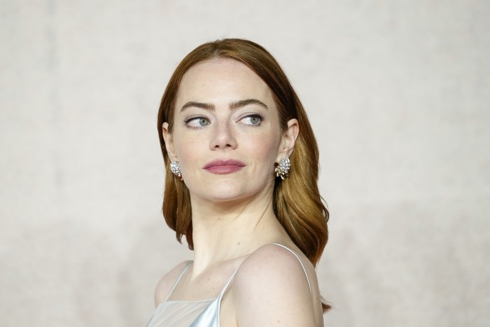 Emma Stone poses for photographers upon arrival at the premiere of the film 'Poor Things' on Thursday, Dec. 14, 2023 in London. (Scott A Garfitt/Invision/AP)