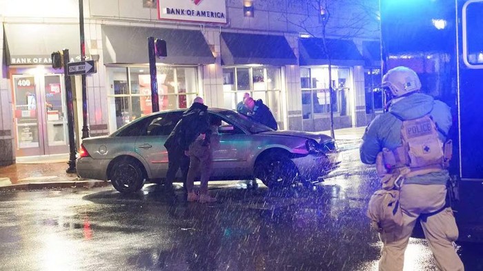 Members of the United States Secret Service react to a vehicle crashing into a Secret Service SUV that was blocking the street as U.S. President Joe Biden exited his campaign headquarters, in Wilmington, Delaware, U.S. December 17, 2023. REUTERS/Nathan Howard Acquire Licensing Rights
