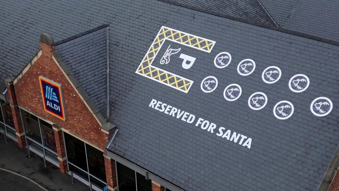 Santa's sleigh and reindeer parking space is painted on the roof of Aldi, in Knutsford, Britain, December 17, 2023. REUTERS/Molly Darlington