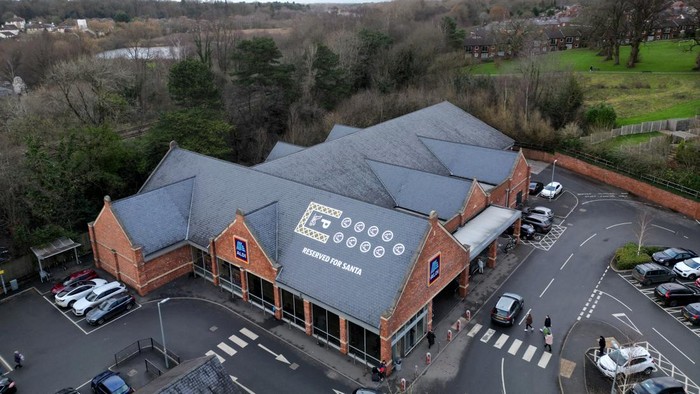 Santa's sleigh and reindeer parking space is painted on the roof of Aldi, in Knutsford, Britain, December 17, 2023. REUTERS/Molly Darlington