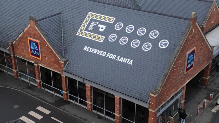 Santa's sleigh and reindeer parking space is painted on the roof of Aldi, in Knutsford, Britain, December 17, 2023. REUTERS/Molly Darlington