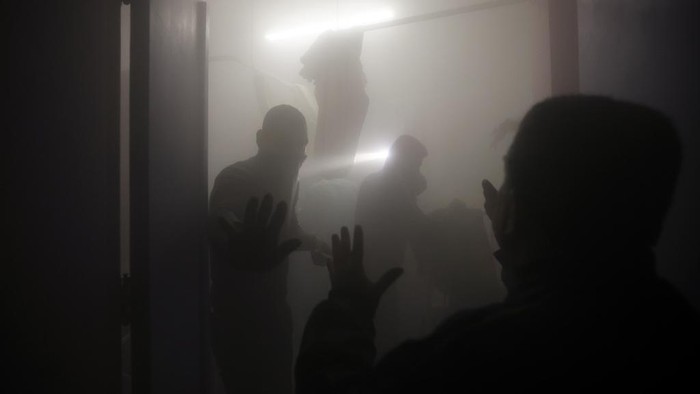 Palestinian paramedics inspect damage in the patient rooms caused by the Israeli strikes on the maternity ward at Nasser Hospital in the town of Khan Younis, southern Gaza Strip, Sunday, Dec. 17, 2023. (AP Photo/Mohammed Dahman)