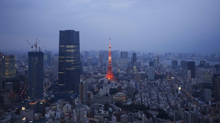 The Tokyo Tower, center, stands next to buildings under construction, as seen from the top of the Roppongi Hills Mori Tower in Tokyo, Wednesday, Feb. 8, 2023. (AP Photo/Hiro Komae)