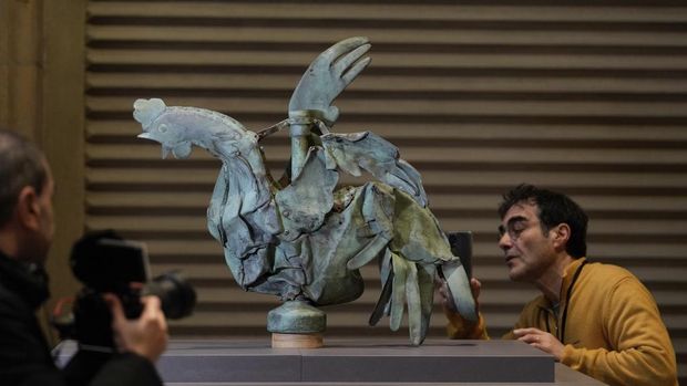The rooster which sat atop of the spire of the Notre-Dame cathedral is seen at the Cité de l'architecture et du patrimoine, in Paris, Friday, Dec. 15, 2023. Roosters are a symbol of France. The small bird that adorned Notre Dame plunged to the ground in the April 2019 fire that collapsed the spire and consumed the roof. (AP Photo/Thibault Camus)