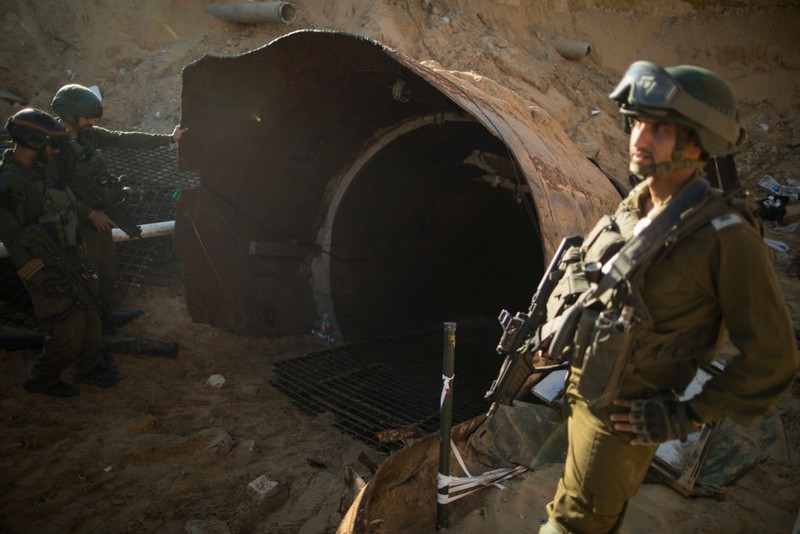 NORTHERN GAZA, GAZA- DECEMBER 15: An Israeli soldier exits a tunnel near the border with Israel on December 15, 2023 in northern Gaza Strip. The Israel Defense Forces say this is the largest tunnel they've found yet in Gaza, comprising branches that extend well over four kilometers (2.5 miles) and reaches 400 meters (1,310 feet) from the Erez crossing. The IDF alleges the project of building the tunnel was led by Mohammed Sinwar, the brother of Hamas leader Yahya Sinwar and was used as part of the Oct. 7 attack, funnelling fighters near the Erez crossing and Israeli border communities. As the IDF have pressed into Gaza as part of their campaign to defeat Hamas, they have highlighted the militant group's extensive tunnel network as emblematic of the way the group embeds itself and its military activity in civilian areas. (Photo by Amir Levy/Getty Images)