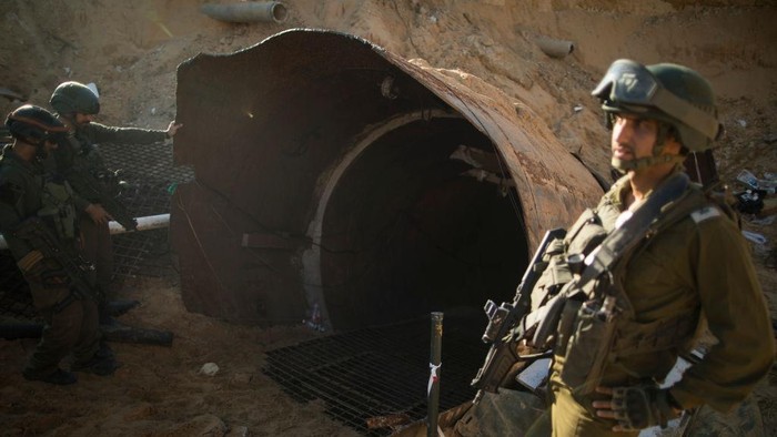 NORTHERN GAZA, GAZA- DECEMBER 15: An Israeli soldier exits a tunnel near the border with Israel on December 15, 2023 in northern Gaza Strip. The Israel Defense Forces say this is the largest tunnel theyve found yet in Gaza, comprising branches that extend well over four kilometers (2.5 miles) and reaches 400 meters (1,310 feet) from the Erez crossing. The IDF alleges the project of building the tunnel was led by Mohammed Sinwar, the brother of Hamas leader Yahya Sinwar and was used as part of the Oct. 7 attack, funnelling fighters near the Erez crossing and Israeli border communities. As the IDF have pressed into Gaza as part of their campaign to defeat Hamas, they have highlighted the militant groups extensive tunnel network as emblematic of the way the group embeds itself and its military activity in civilian areas. (Photo by Amir Levy/Getty Images)