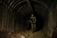 NORTHERN GAZA, GAZA- DECEMBER 15: An Israeli soldier exits a tunnel near the border with Israel on December 15, 2023 in northern Gaza Strip. The Israel Defense Forces say this is the largest tunnel theyve found yet in Gaza, comprising branches that extend well over four kilometers (2.5 miles) and reaches 400 meters (1,310 feet) from the Erez crossing. The IDF alleges the project of building the tunnel was led by Mohammed Sinwar, the brother of Hamas leader Yahya Sinwar and was used as part of the Oct. 7 attack, funnelling fighters near the Erez crossing and Israeli border communities. As the IDF have pressed into Gaza as part of their campaign to defeat Hamas, they have highlighted the militant groups extensive tunnel network as emblematic of the way the group embeds itself and its military activity in civilian areas. (Photo by Amir Levy/Getty Images)