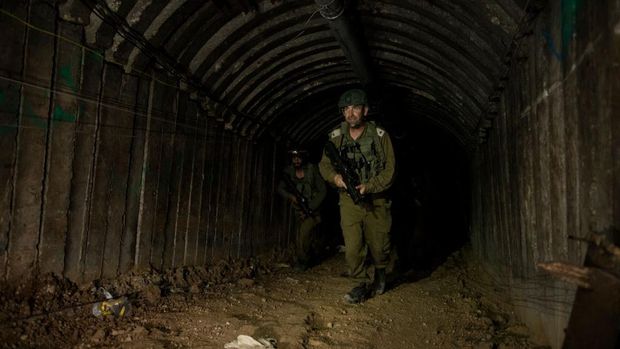 NORTHERN GAZA, GAZA- DECEMBER 15: An Israeli soldier exits a tunnel near the border with Israel on December 15, 2023 in northern Gaza Strip. The Israel Defense Forces say this is the largest tunnel they've found yet in Gaza, comprising branches that extend well over four kilometers (2.5 miles) and reaches 400 meters (1,310 feet) from the Erez crossing. The IDF alleges the project of building the tunnel was led by Mohammed Sinwar, the brother of Hamas leader Yahya Sinwar and was used as part of the Oct. 7 attack, funnelling fighters near the Erez crossing and Israeli border communities. As the IDF have pressed into Gaza as part of their campaign to defeat Hamas, they have highlighted the militant group's extensive tunnel network as emblematic of the way the group embeds itself and its military activity in civilian areas. (Photo by Amir Levy/Getty Images)