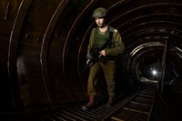 NORTHERN GAZA, GAZA- DECEMBER 15: An Israeli soldier exits a tunnel near the border with Israel on December 15, 2023 in northern Gaza Strip. The Israel Defense Forces say this is the largest tunnel theyve found yet in Gaza, comprising branches that extend well over four kilometers (2.5 miles) and reaches 400 meters (1,310 feet) from the Erez crossing. The IDF alleges the project of building the tunnel was led by Mohammed Sinwar, the brother of Hamas leader Yahya Sinwar and was used as part of the Oct. 7 attack, funnelling fighters near the Erez crossing and Israeli border communities. As the IDF have pressed into Gaza as part of their campaign to defeat Hamas, they have highlighted the militant groups extensive tunnel network as emblematic of the way the group embeds itself and its military activity in civilian areas. (Photo by Amir Levy/Getty Images)