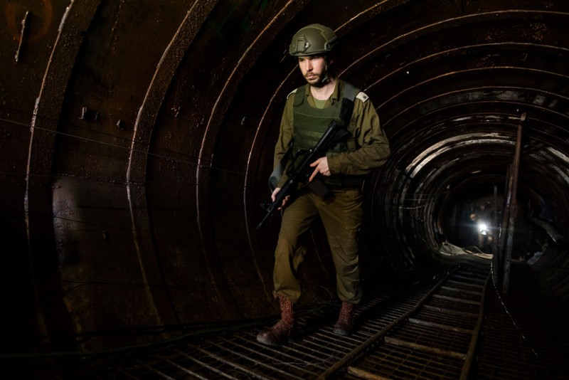 NORTHERN GAZA, GAZA- DECEMBER 15: An Israeli soldier exits a tunnel near the border with Israel on December 15, 2023 in northern Gaza Strip. The Israel Defense Forces say this is the largest tunnel they've found yet in Gaza, comprising branches that extend well over four kilometers (2.5 miles) and reaches 400 meters (1,310 feet) from the Erez crossing. The IDF alleges the project of building the tunnel was led by Mohammed Sinwar, the brother of Hamas leader Yahya Sinwar and was used as part of the Oct. 7 attack, funnelling fighters near the Erez crossing and Israeli border communities. As the IDF have pressed into Gaza as part of their campaign to defeat Hamas, they have highlighted the militant group's extensive tunnel network as emblematic of the way the group embeds itself and its military activity in civilian areas. (Photo by Amir Levy/Getty Images)