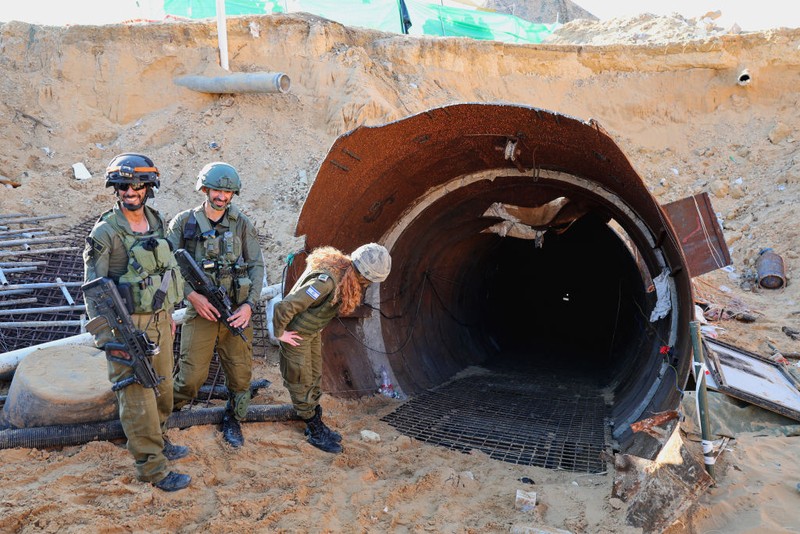 In this picture taken during a media tour organised by the Israeli military on December 15, 2023, soldiers visit a tunnel that Hamas reportedly used to attack Israel through the Erez border crossing on October 7. The Israeli army said on December 17, 2023 it had uncovered the biggest Hamas tunnel in the Gaza Strip so far, just a few hundred metres from the Erez border crossing. (Photo by JACK GUEZ / AFP) (Photo by JACK GUEZ/AFP via Getty Images)