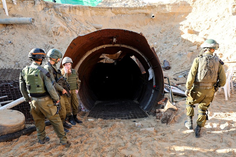 In this picture taken during a media tour organised by the Israeli military on December 15, 2023, soldiers visit a tunnel that Hamas reportedly used to attack Israel through the Erez border crossing on October 7. The Israeli army said on December 17, 2023 it had uncovered the biggest Hamas tunnel in the Gaza Strip so far, just a few hundred metres from the Erez border crossing. (Photo by JACK GUEZ / AFP) (Photo by JACK GUEZ/AFP via Getty Images)