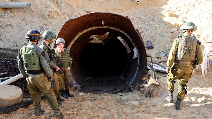 In this picture taken during a media tour organised by the Israeli military on December 15, 2023, soldiers visit a tunnel that Hamas reportedly used to attack Israel through the Erez border crossing on October 7. The Israeli army said on December 17, 2023 it had uncovered the biggest Hamas tunnel in the Gaza Strip so far, just a few hundred metres from the Erez border crossing. (Photo by JACK GUEZ / AFP) (Photo by JACK GUEZ/AFP via Getty Images)