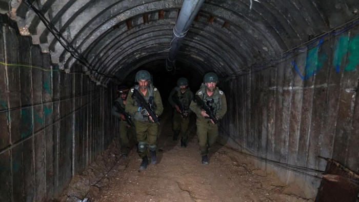 In this picture taken during a media tour organised by the Israeli military on December 15, 2023, soldiers visit a tunnel that Hamas reportedly used to attack Israel through the Erez border crossing on October 7. The Israeli army said on December 17, 2023 it had uncovered the biggest Hamas tunnel in the Gaza Strip so far, just a few hundred metres from the Erez border crossing. (Photo by JACK GUEZ / AFP) (Photo by JACK GUEZ/AFP via Getty Images)