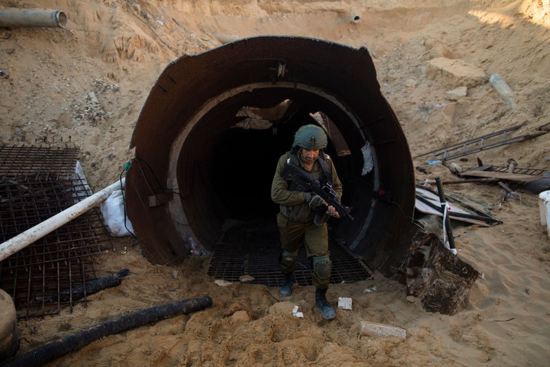 NORTHERN GAZA, GAZA- DECEMBER 15: An Israeli soldier exits a tunnel near the border with Israel on December 15, 2023 in northern Gaza Strip. The Israel Defense Forces say this is the largest tunnel they've found yet in Gaza, comprising branches that extend well over four kilometers (2.5 miles) and reaches 400 meters (1,310 feet) from the Erez crossing. The IDF alleges the project of building the tunnel was led by Mohammed Sinwar, the brother of Hamas leader Yahya Sinwar and was used as part of the Oct. 7 attack, funnelling fighters near the Erez crossing and Israeli border communities. As the IDF have pressed into Gaza as part of their campaign to defeat Hamas, they have highlighted the militant group's extensive tunnel network as emblematic of the way the group embeds itself and its military activity in civilian areas. (Photo by Amir Levy/Getty Images)