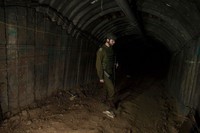 NORTHERN GAZA, GAZA- DECEMBER 15: An Israeli soldier walks through a tunnel near the border with Israel on December 15, 2023 in northern Gaza Strip. The Israel Defense Forces say this is the largest tunnel theyve found yet in Gaza, comprising branches that extend well over four kilometers (2.5 miles) and reaches 400 meters (1,310 feet) from the Erez crossing. The IDF alleges the project of building the tunnel was led by Mohammed Sinwar, the brother of Hamas leader Yahya Sinwar and was used as part of the Oct. 7 attack, funnelling fighters near the Erez crossing and Israeli border communities. As the IDF have pressed into Gaza as part of their campaign to defeat Hamas, they have highlighted the militant groups extensive tunnel network as emblematic of the way the group embeds itself and its military activity in civilian areas. (Photo by Amir Levy/Getty Images)