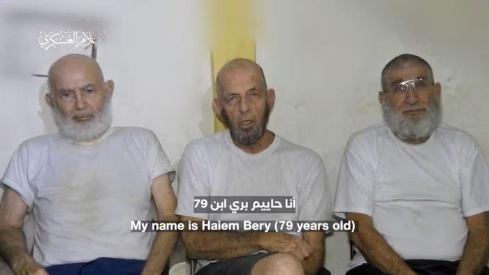 Three Israeli hostages appear in footage by Palestinian Islamist group Hamas at a location given as Gaza, in this still image obtained from handout video released December 18, 2023. Hamas Military Wing/Handout via REUTERS Acquire Licensing Rights