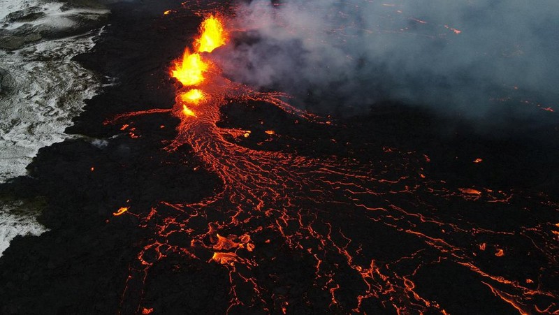 A drone picture shows lava spewing from the site of the volcanic eruption north of Grindavik, photographed from Sylingarfell, Iceland, December 19, 2023. REUTERS/Sigurdur Davidsson