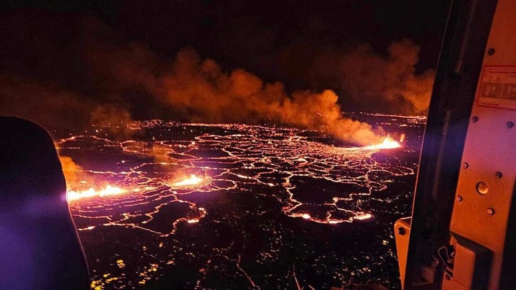 A volcano spews lava and smoke as it erupts near Grindavik, Iceland, December 19, 2023. Civil Protection of Iceland/Handout via REUTERS THIS IMAGE HAS BEEN SUPPLIED BY A THIRD PARTY. NO RESALES. NO ARCHIVES. MANDATORY CREDIT