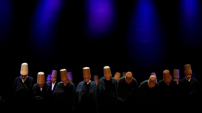 Whirling dervishes of the Mevlevi order perform during a Sheb-i Arus ceremony in Istanbul, Turkey, Sunday, Dec. 17, 2023. Every December a series of events are held to commemorate the death of 13th century Islamic scholar, poet and Sufi mystic Jalaladdin Rumi in different cities of Turkey. (AP Photo/Emrah Gurel)