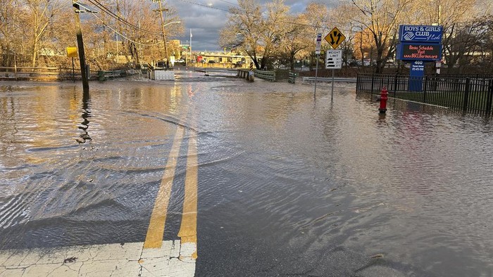 Water floods a bridge over the Saddle River and adjacent roadways in Lodi, New Jersey, on Monday, December 18, 2023. Just days before the Christmas holiday, people across the northeastern U.S. were mopping up Tuesday after a major storm dumped torrential rains and brought damaging winds from Pennsylvania to Maine, as some rivers in the region rose even higher. More than 5 inches (13 centimeters) of rain fell in parts of New Jersey and northeastern Pennsylvania, and portions of several other states got more than 4 inches (10 centimeters), according to the National Weather Service. (AP Photo/Ted Shaffrey)
