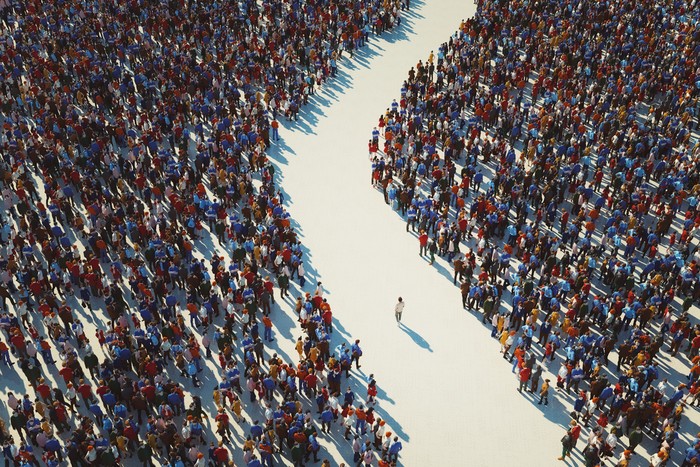 Man walking in crowds of people. 3D generated image.